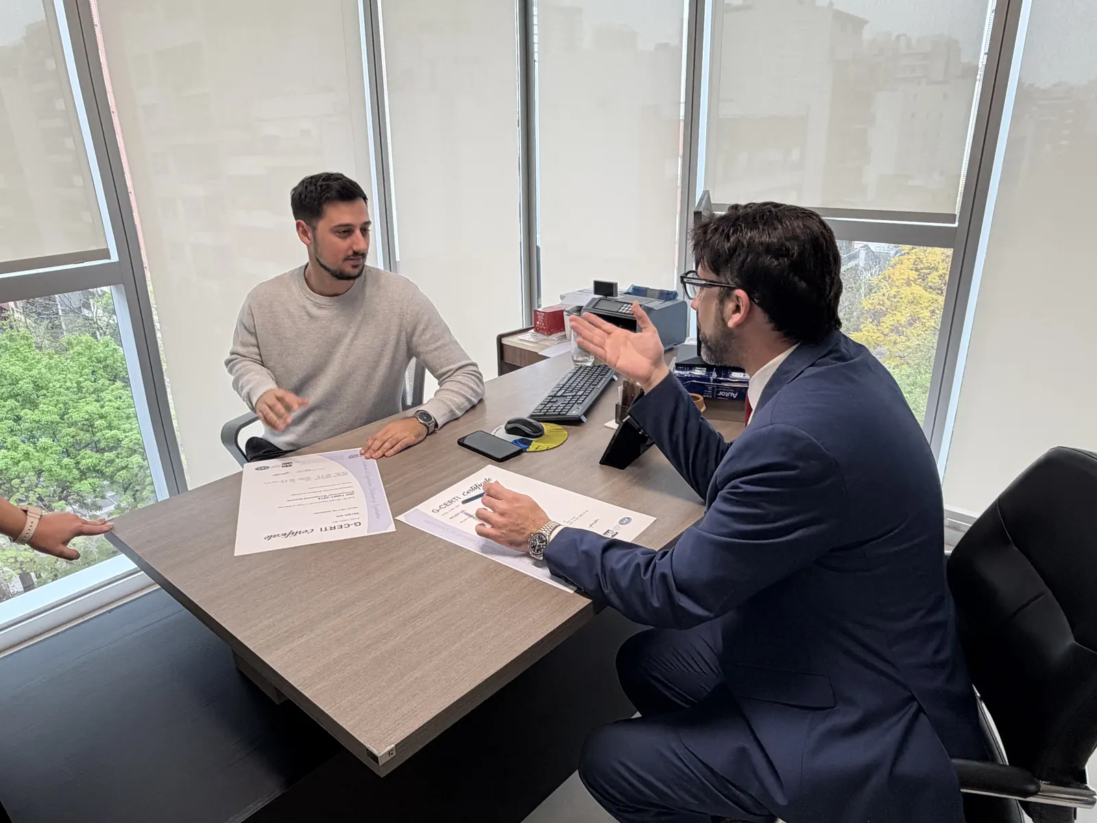 Signing documents at a desk
