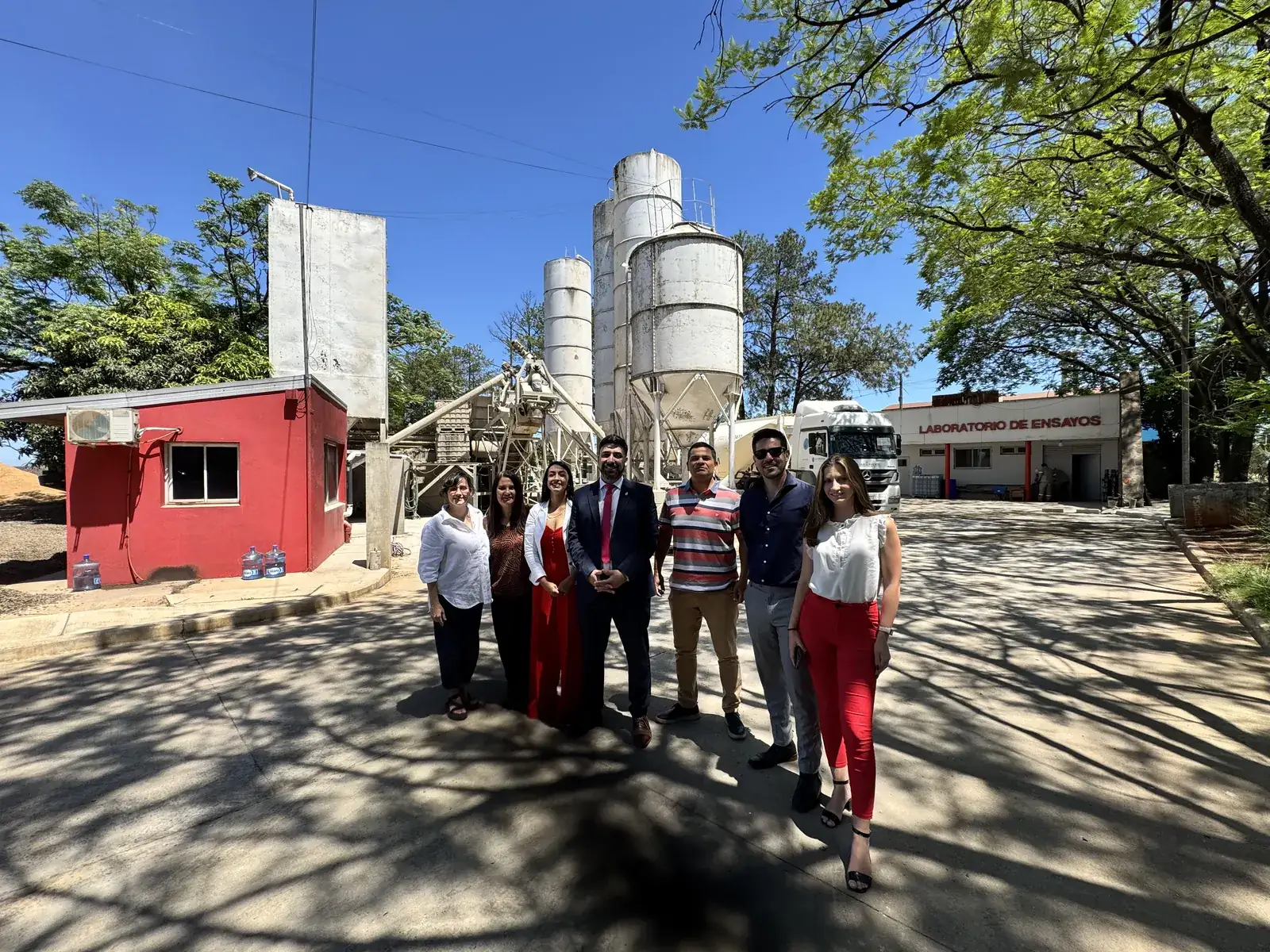 Group of people at the entrance of a plant